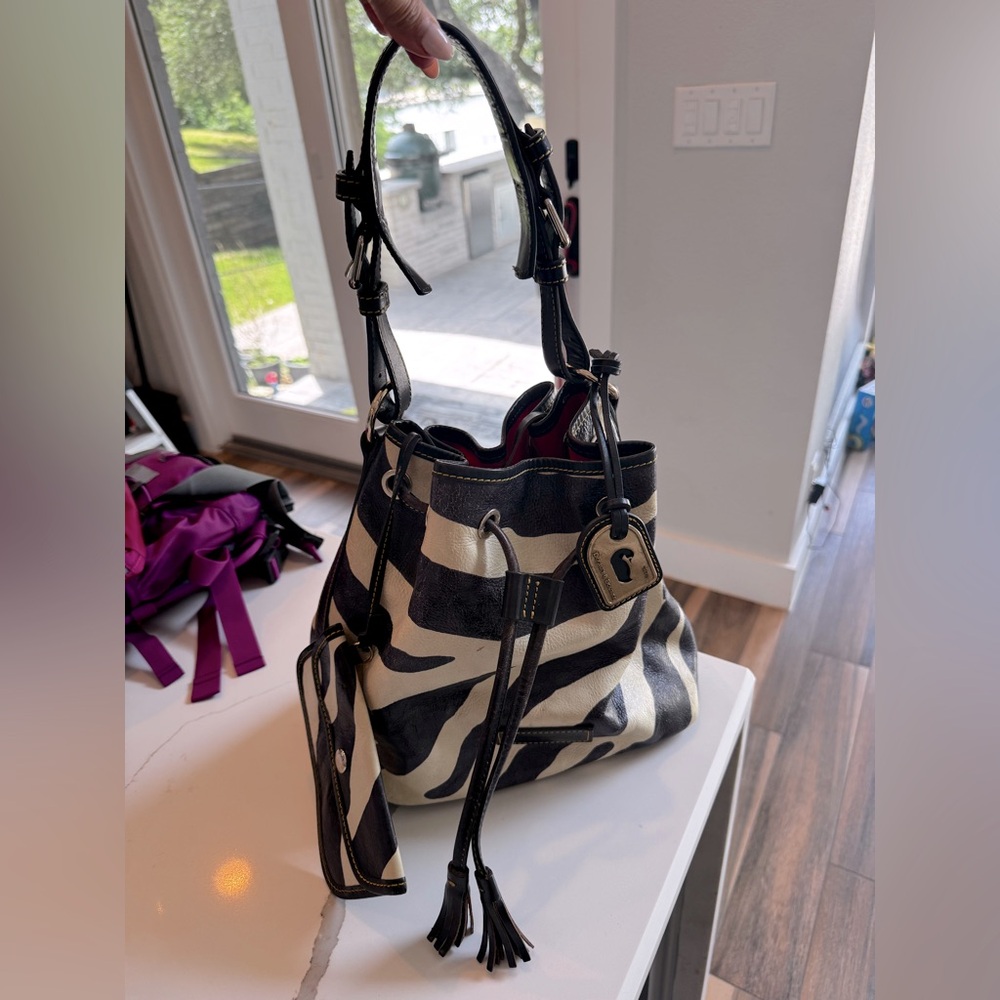 Dooney & Burke
Black and Cream Zebra Print Leather bucket Bag